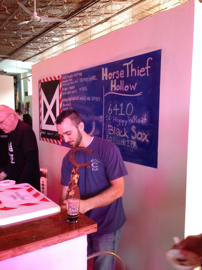 Andy pouring Horse Thief Hollow's Black Sox IPA.