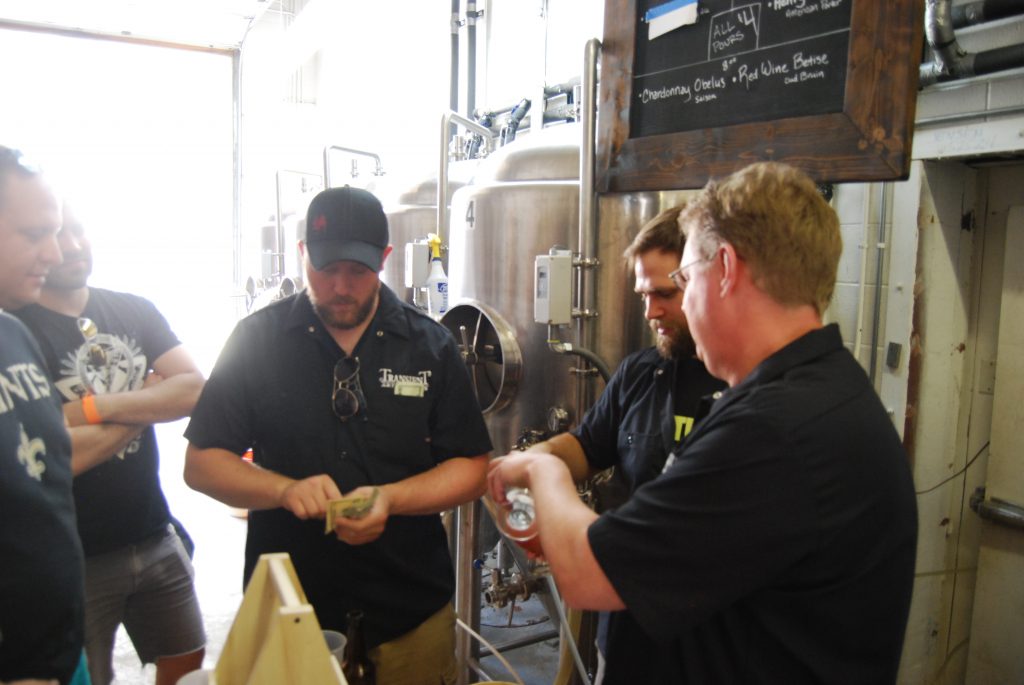 Chris pouring Raspberry Maigre shortly after tapping it.