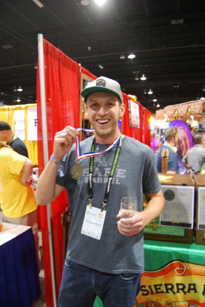 Alex from The Rare Barrel with their gold medal for Cosmic Dust.